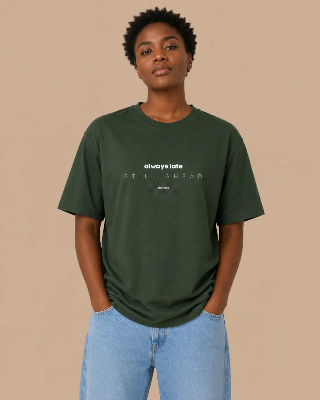 Female model wearing the Always Late Still Ahead forest green oversized T-shirt, front view