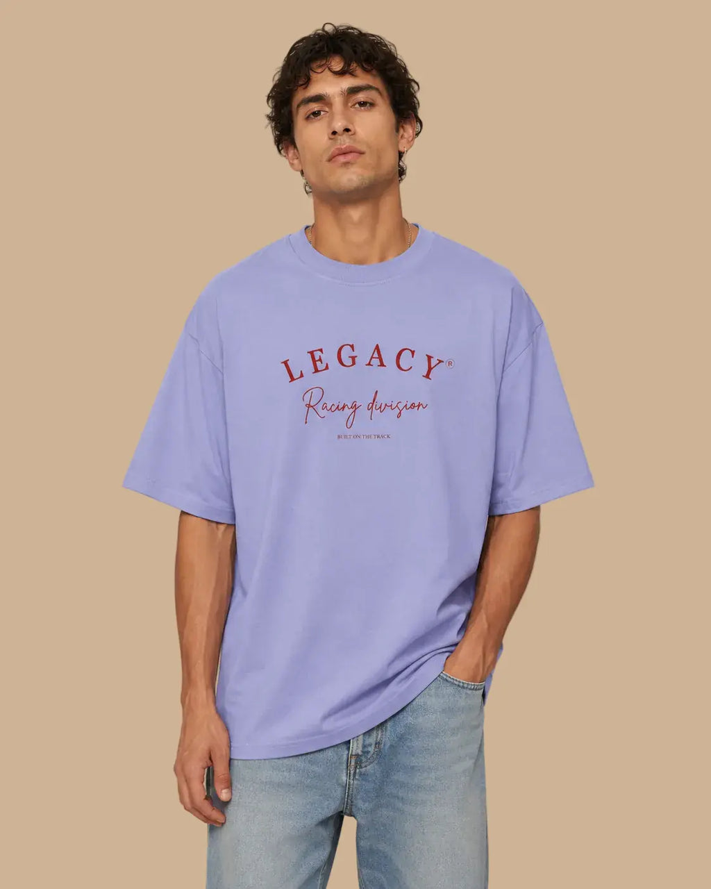 Male model wearing the Legacy Racing Division violet oversized T-shirt, front view